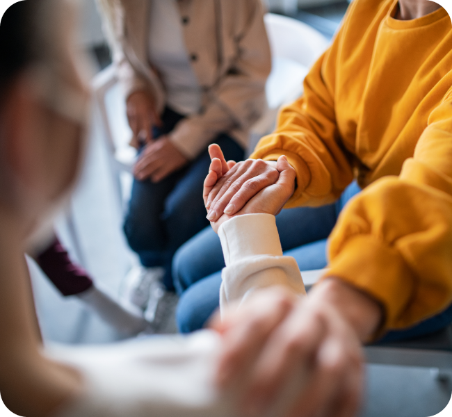 a close up shot of two people holding hands