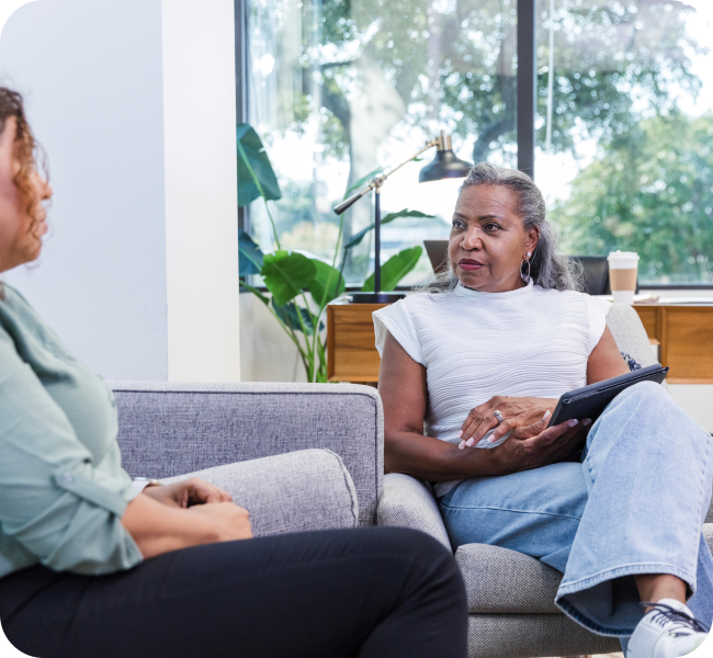 A woman and her counselor sitting in a therapy session.