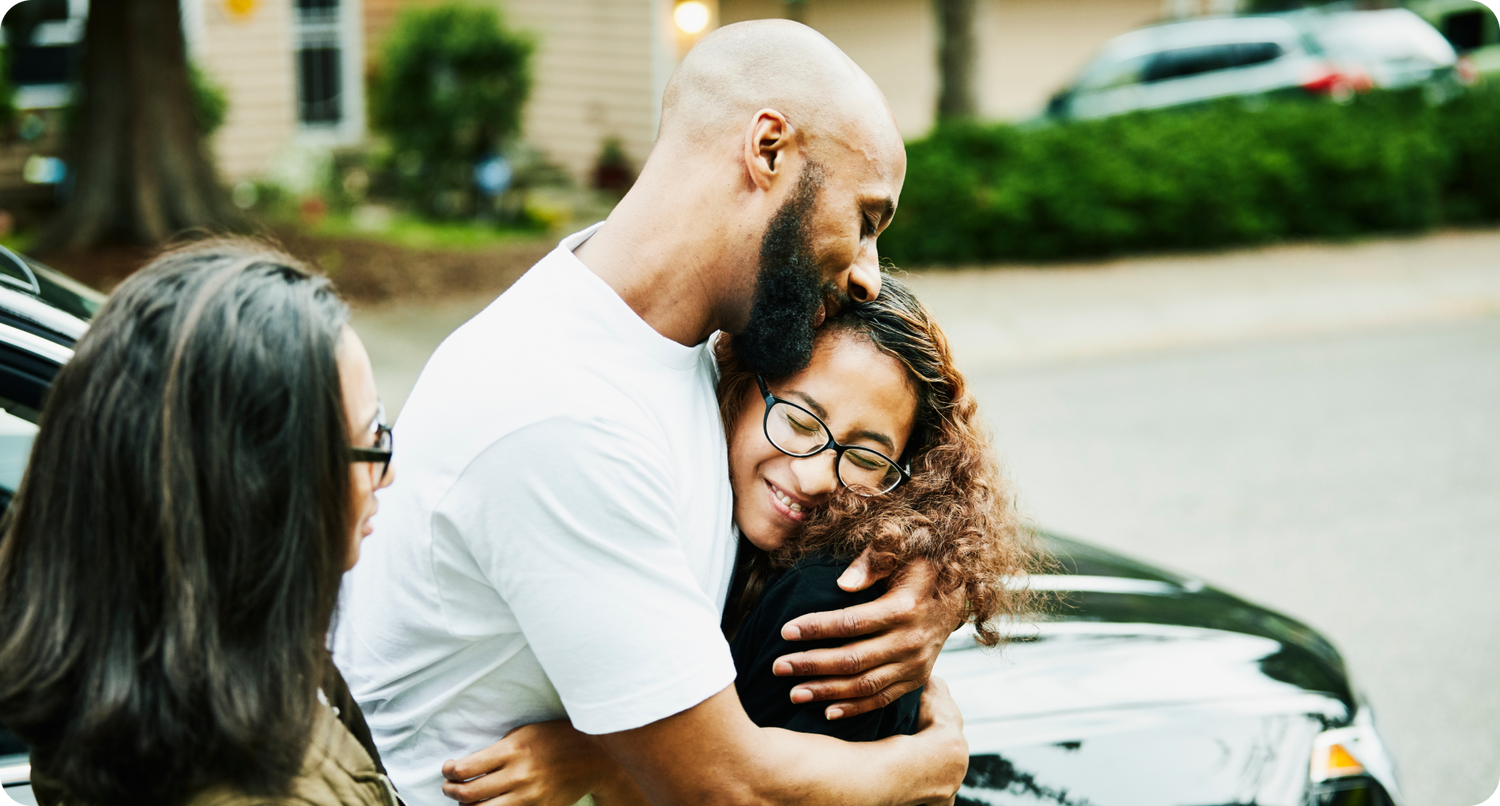 A father and his daughter share a warm embrace