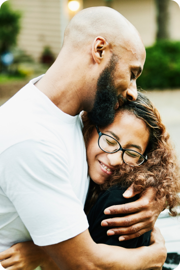 A father and his daughter share a warm embrace