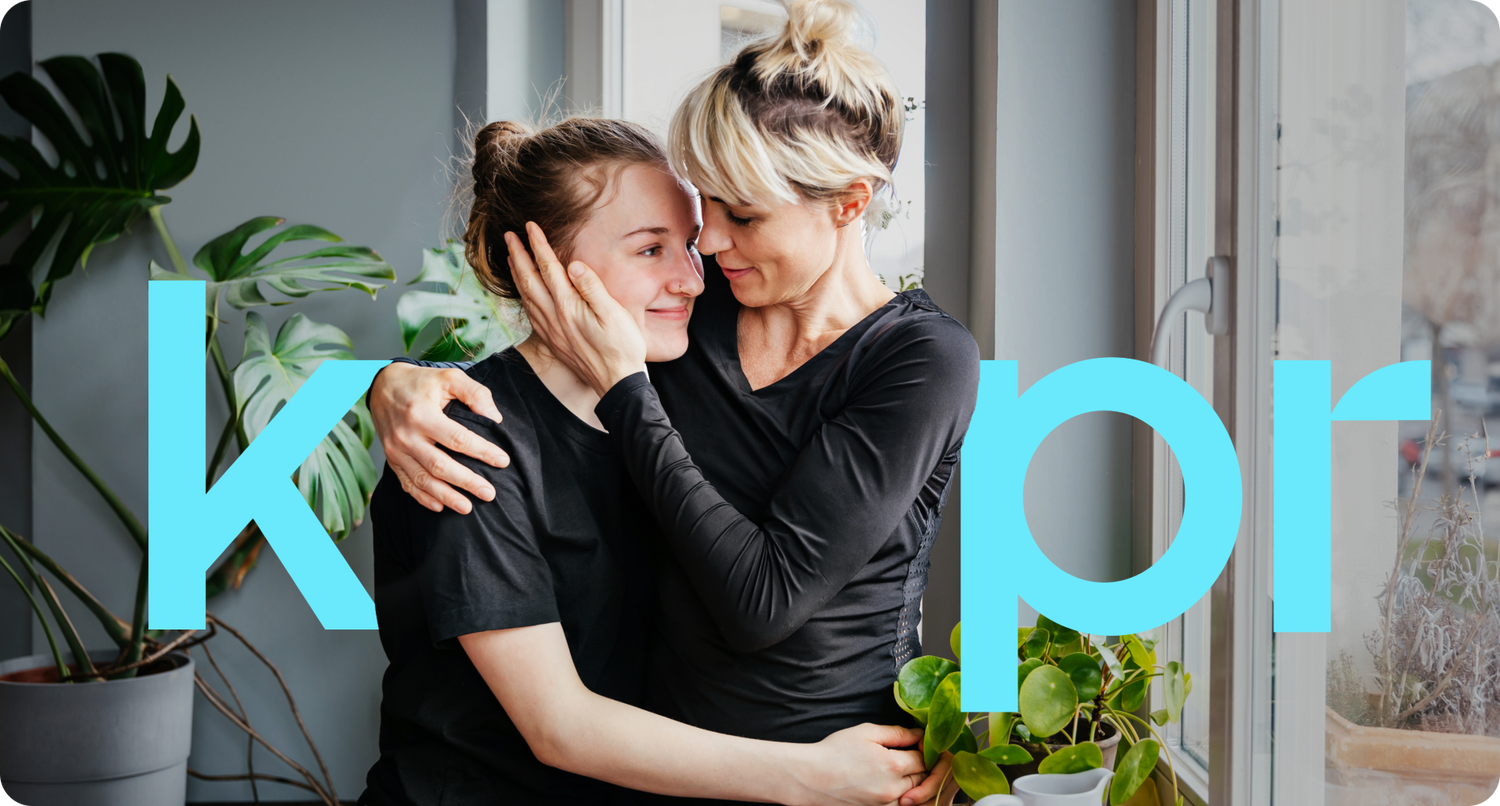 Two women sharing a close embrace in a heartfelt moment.