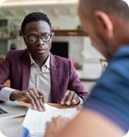 A lawyer and his client reviewing documents.